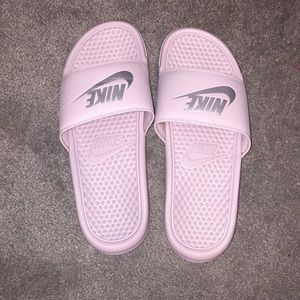 Light pink and silver Nike slides